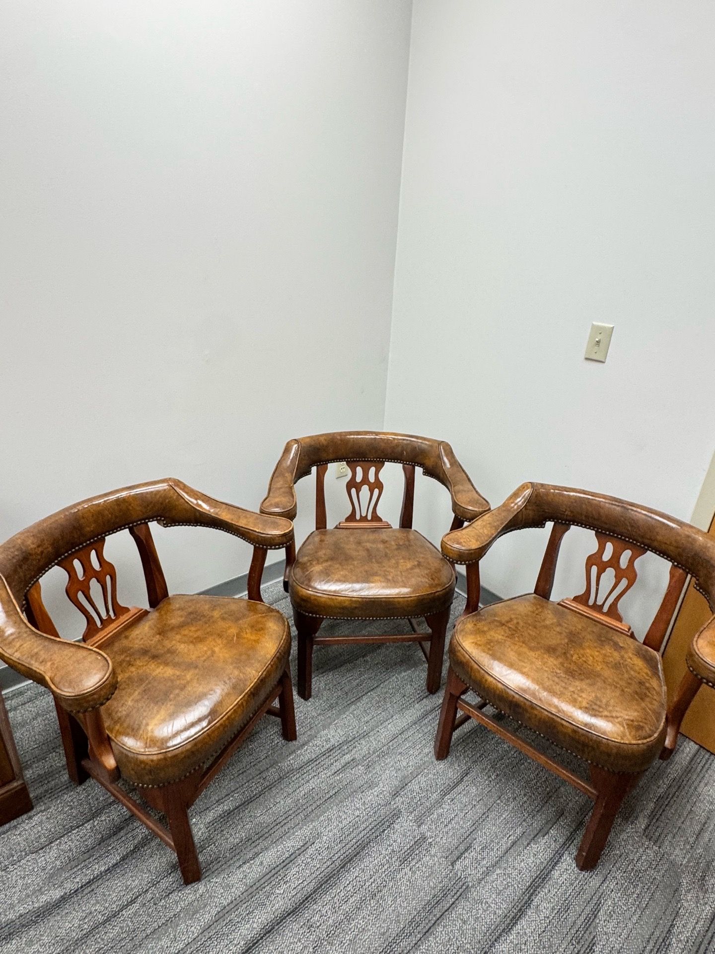 Chippendale-style leather barrel arm chairs