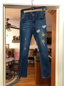 Girls Skinny Jeans Size 12 1/2 Plus.  With Stars And Stars.  Really Cute .  Made of 55% Cotton, 19% Polyester, 15% Lyocell, 10% Viscose and 1% Spandex