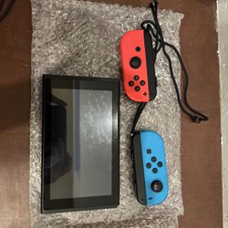 Brand New Blue And Red Nintendo Switch With Wrist Strap