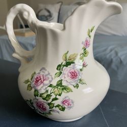 Pitcher With A Flower Design That Can Be Used As A Vase