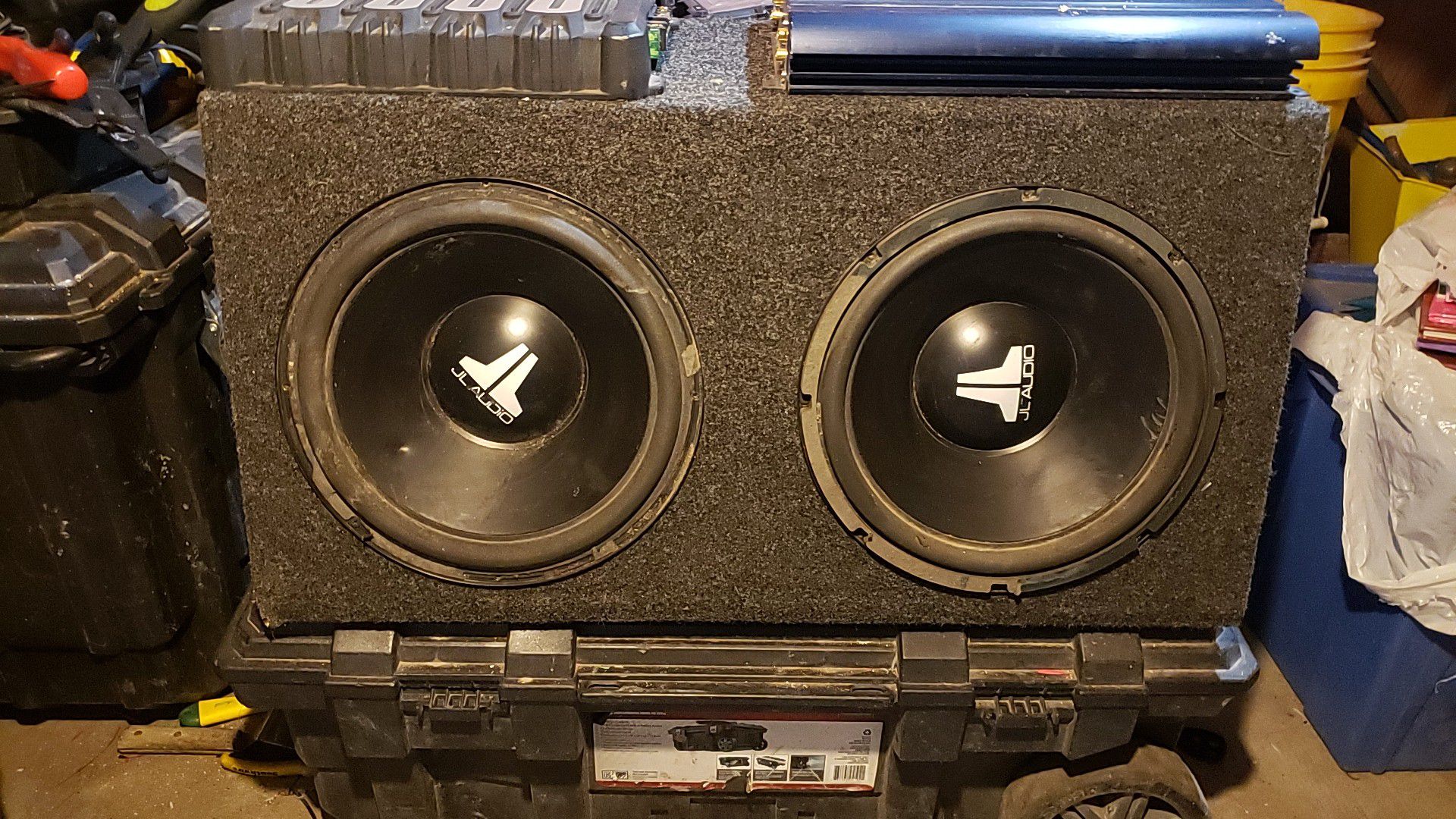 Two J L AUDIO 12 inch ,W4 dual voice with two amps