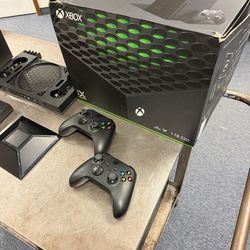 Xbox series X w/ cooler, 2 controllers, and box