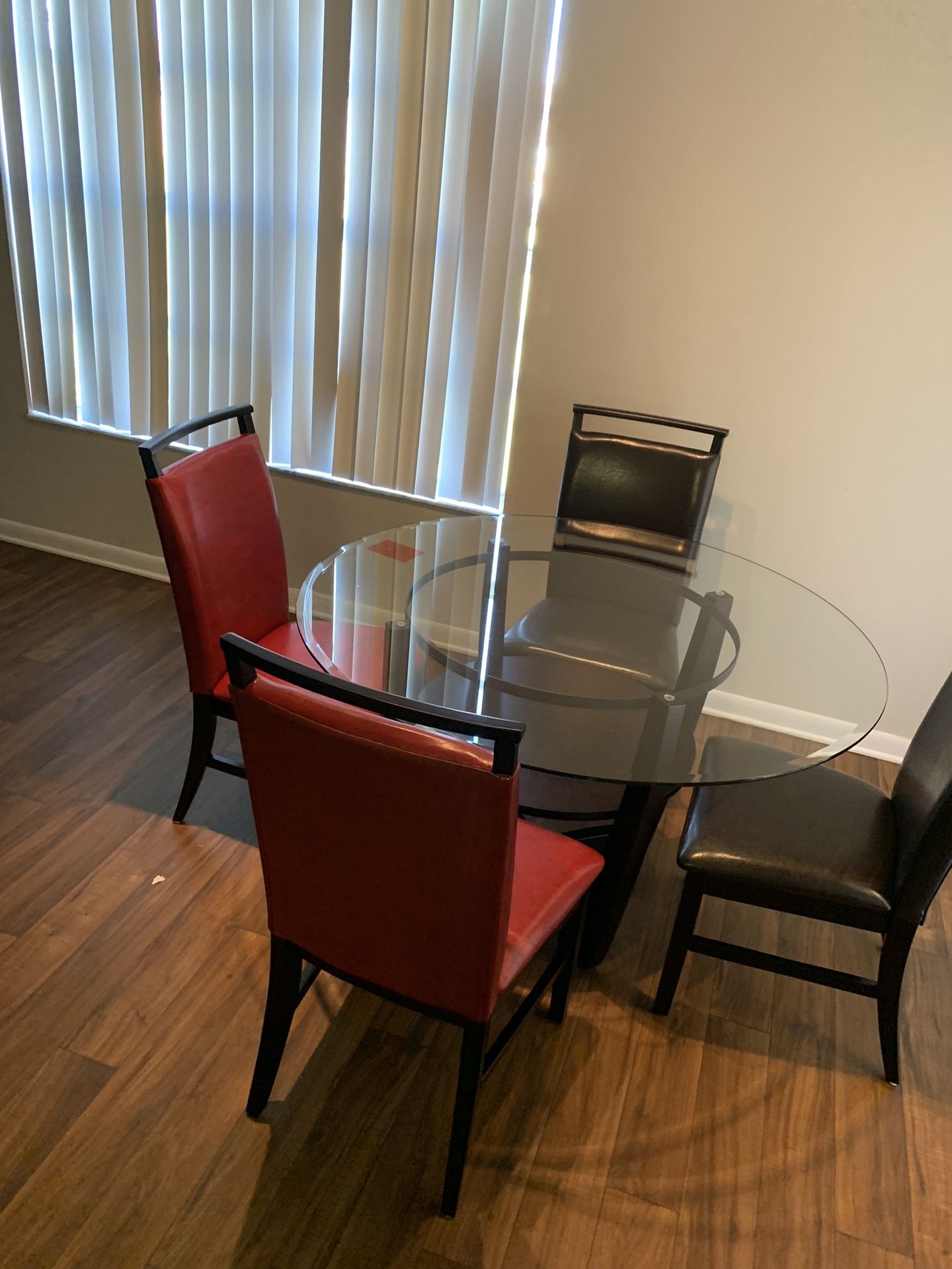 Glass top kitchen table w 2 Black & 2 red chairs