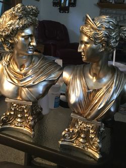 Pair of gold colored statues. Green Bay Wisconsin.