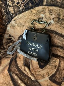 Moshino Handle with care bag