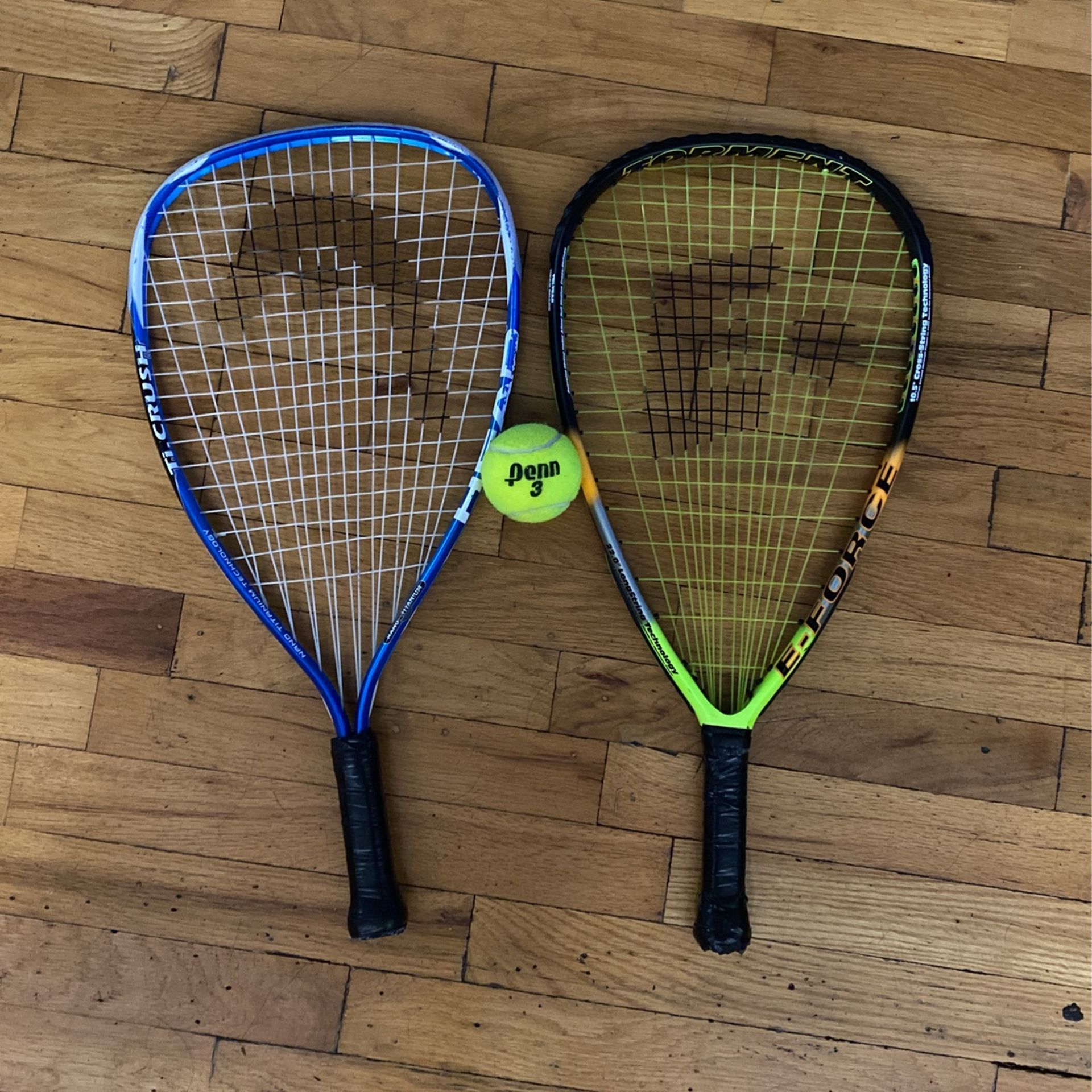 2 tennis rackets and ball