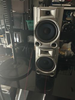 Two matching silver Sony bookshelf speakers
