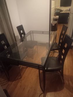 Glass table four chairs