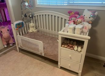 Baby Crib with attached changer and storage drawers
