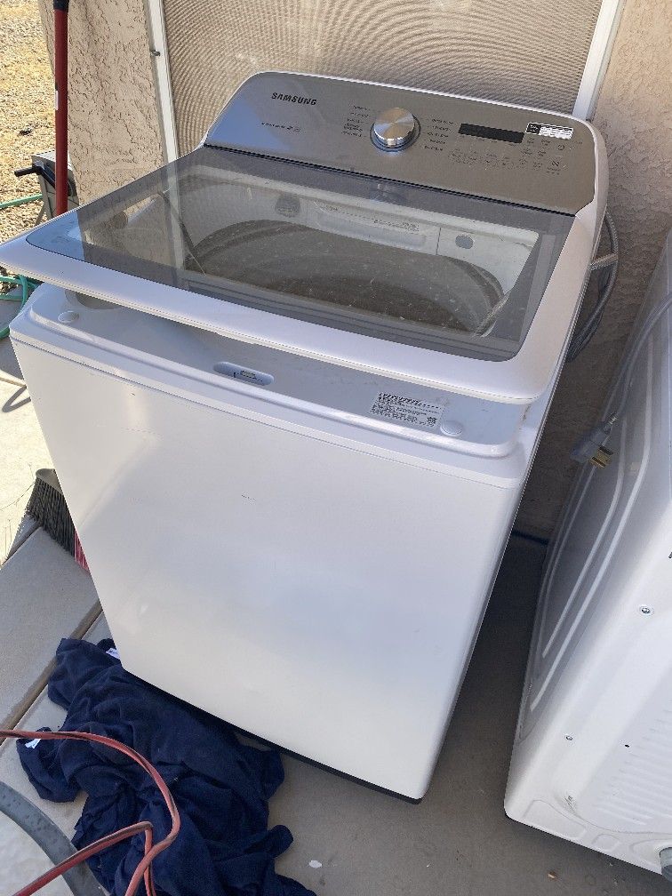 Expensive washer and dryer And a leather recliner couch