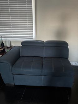 Gray Leather Loveseat with Adjustable Headrests