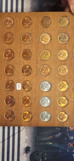 Penny Collection on Wooden Display Board