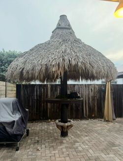 Thatched tiki bar table