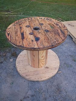 Rolling, rotating Priority Wire wooden spool