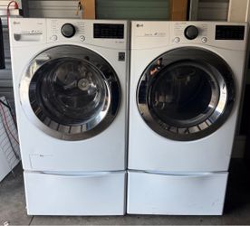 LG front-loading washer and dryer with pedestals