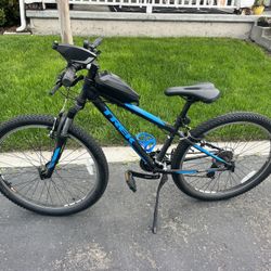 26” Trek Mountain Bike In Black And Blue With Red Giro Helmet