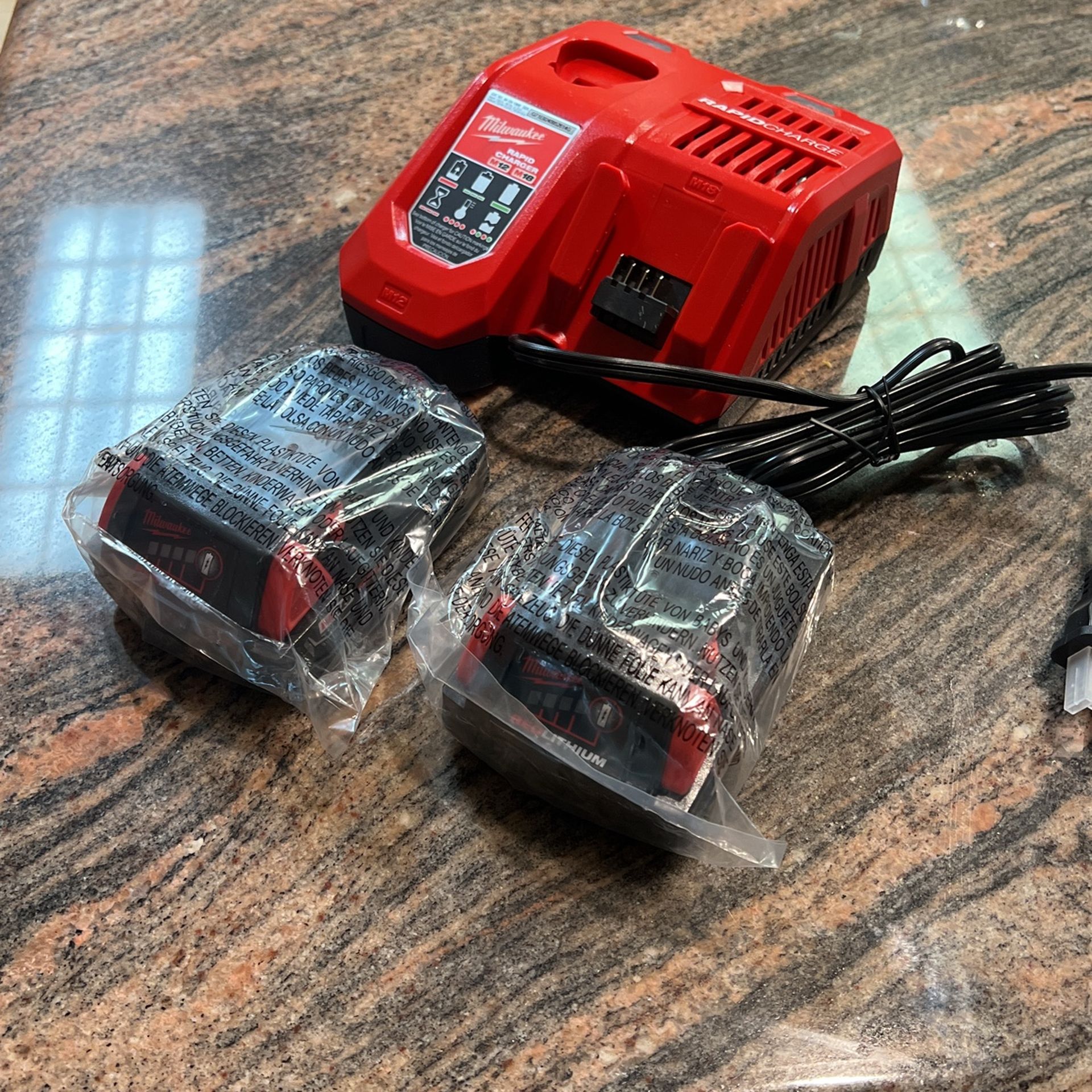 Milwaukee Rapid Charger + (2) CP 1.5 Batteries