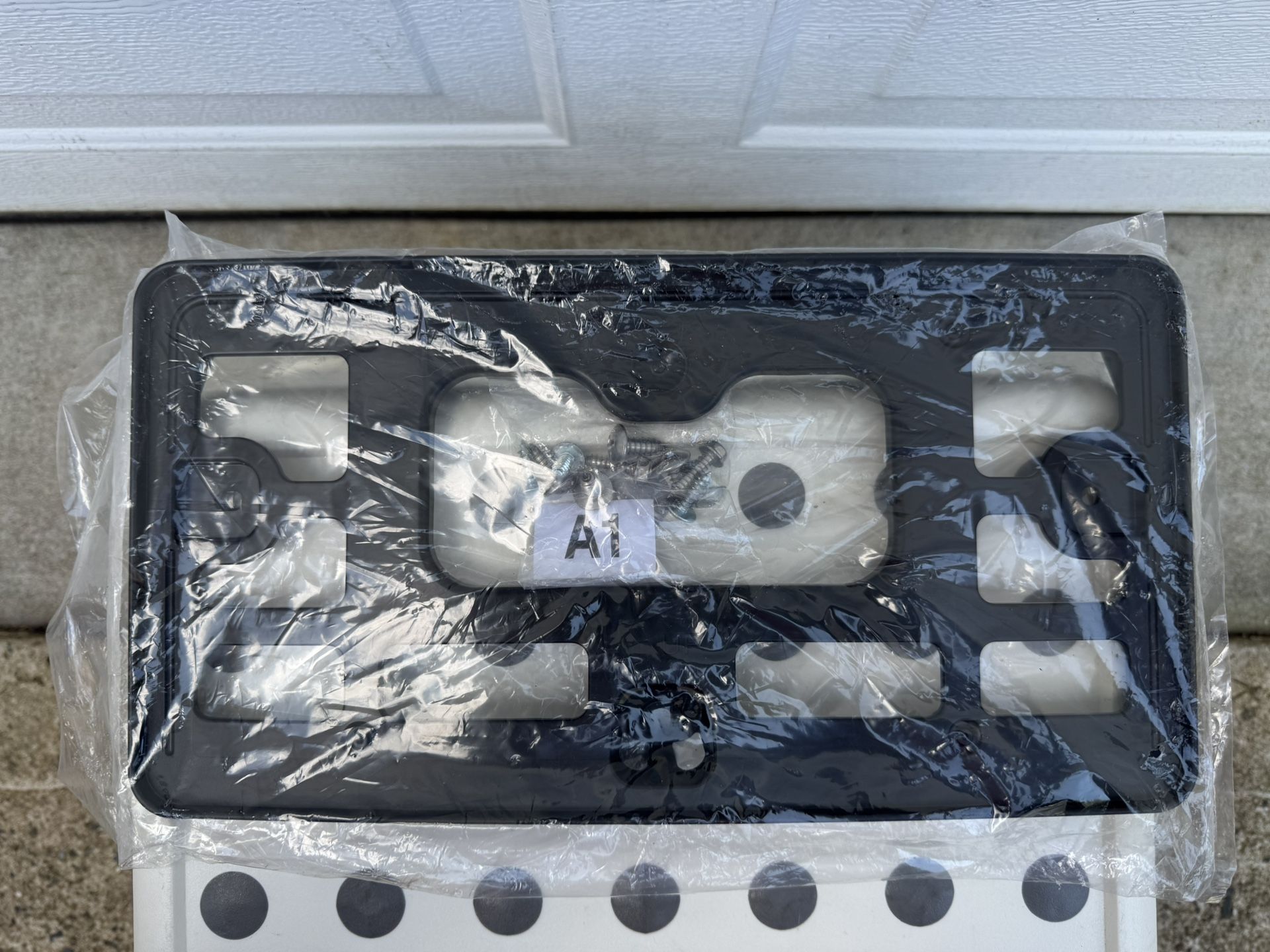 Brand new Honda car license plate frame (with installation screws)