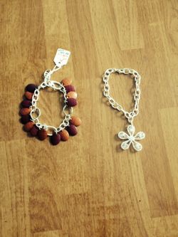 Made it with silver chain. The first one has plastic beads. The price is $6.00 and the price for the second is $9.00