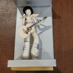 Vintage Elvis Presley in White Jumpsuit  w/Guitar Blown Glass Christmas 
Ornament. New, in original box. Please see the photos. It is 
approximately 8