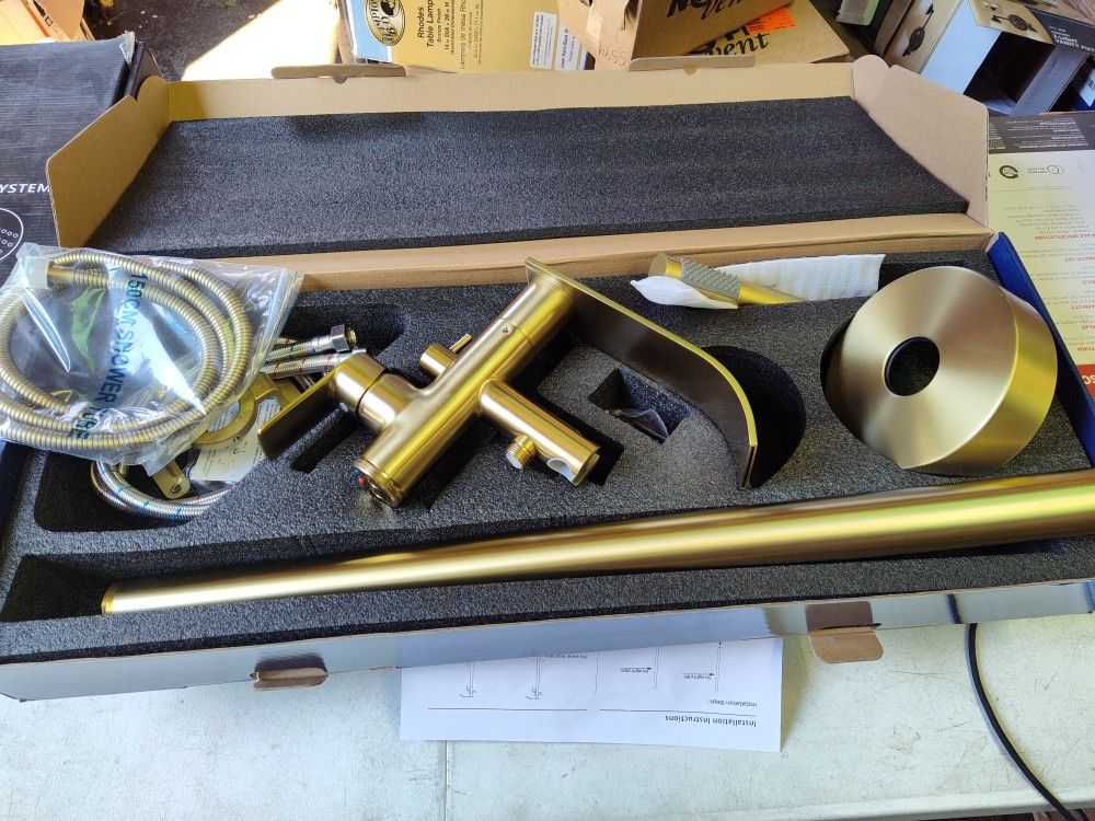 Single Handle Waterfall Style Bathtub Filler Faucet With Hand Sprayer In Brushed Gold