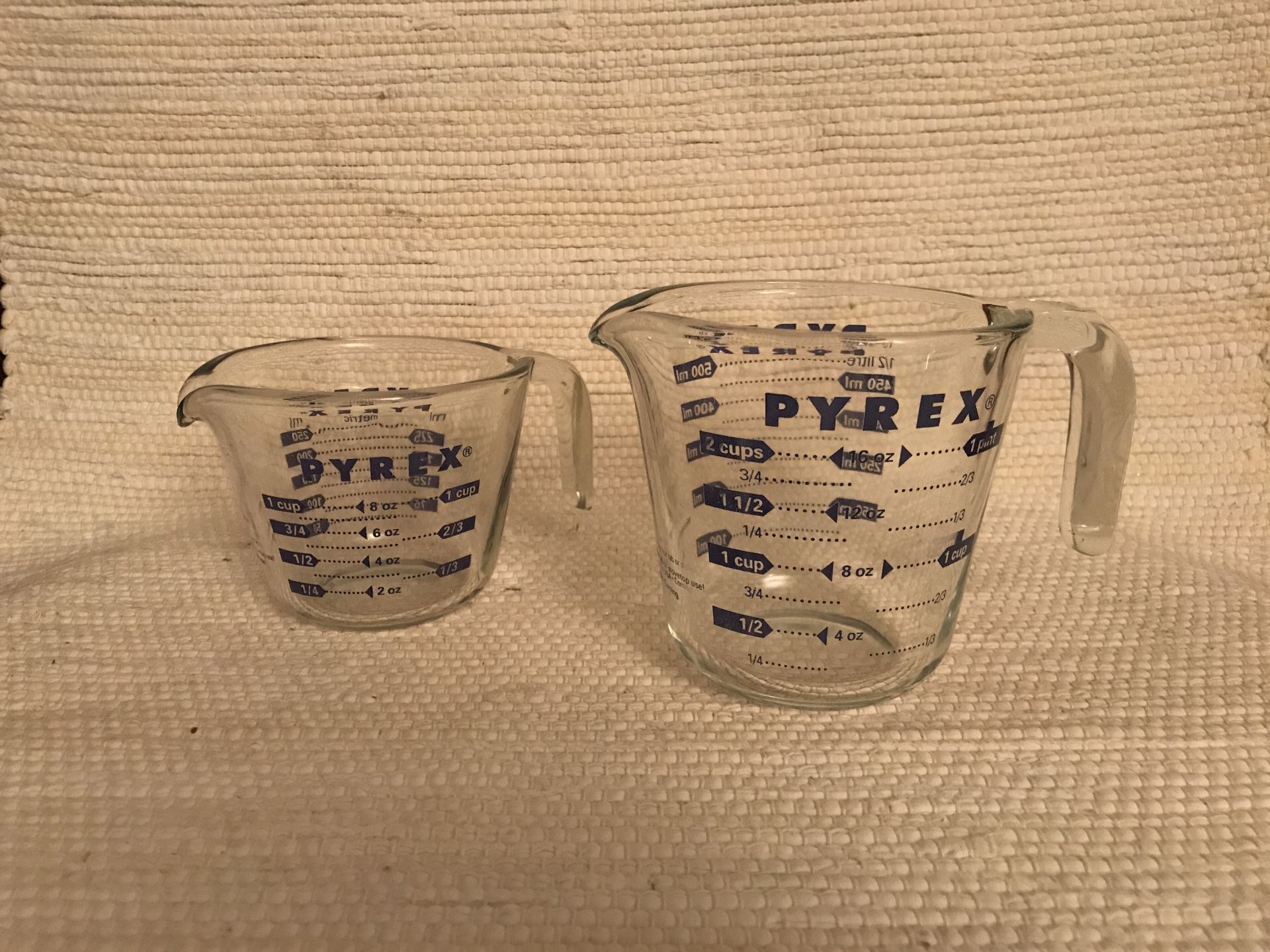 Two vintage glass PYREX measuring glasses cups