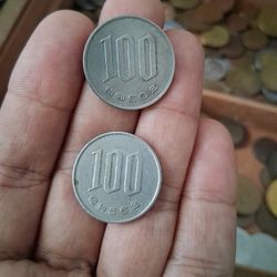 Japanese 100 Yen coin from the Shōwa era. 
Denomination: 100 Japanese Yen. 
Composition: Copper-nickel alloy (75% copper, 25% nickel). 