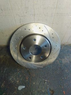 Drilled and slotted performance front brake rotor