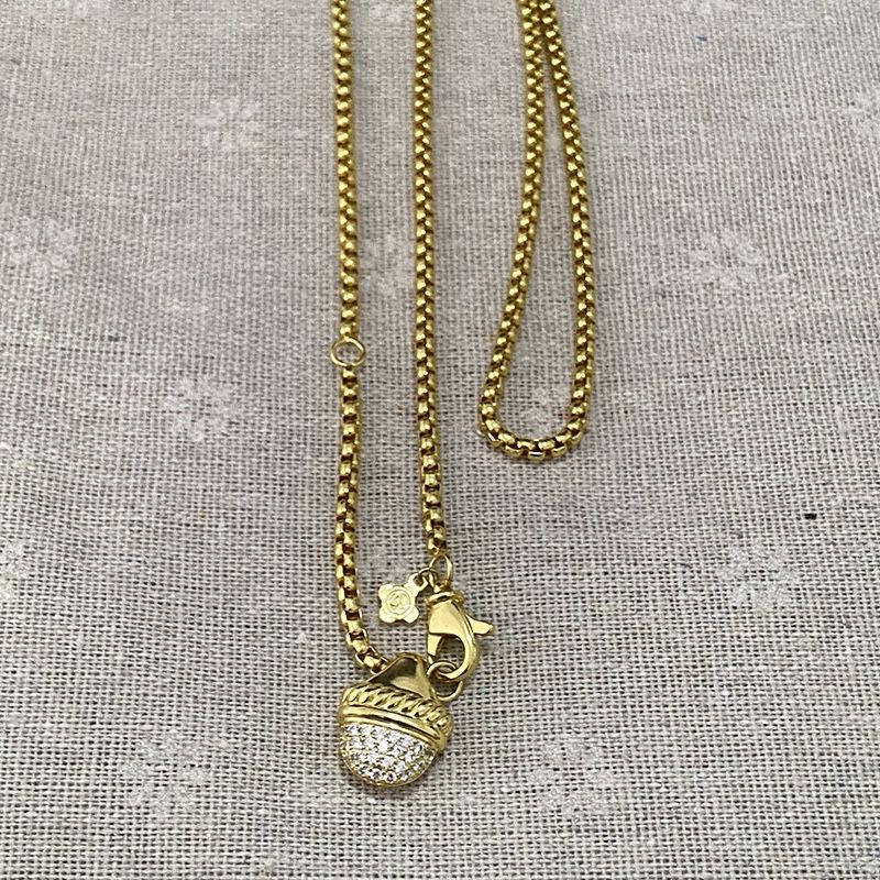 David Yurman's Classic Pendant Nut Is Studded With Sparkling Gold-Tone Cuban Necklace 