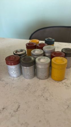 12  vintage Kodak metal film canisters
