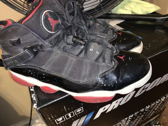 Size 11 Jordan 11s bred shoes