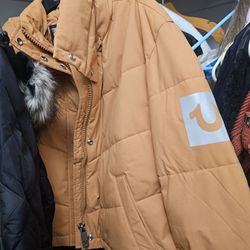 True Religion branded puffer jacket, recognized by the signature horseshoe logo on the sleeve-$80
