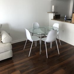 Glass dining Table + 4 White Chairs 