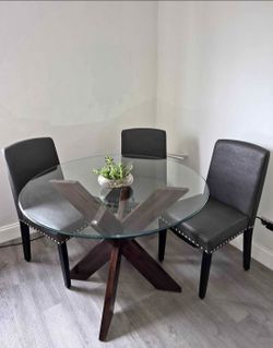 Almost new modren set of 3 dining chairs W glass table