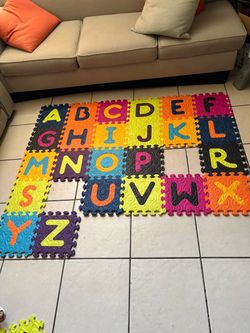 Alphabet Foam Puzzle Play Mat Set.   2 letters missing,but it has more extra letters