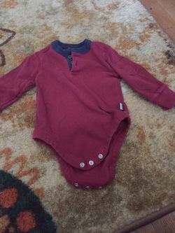 Little boys long sleeve onesie with pocket on the sleeve size 3 to 6 months