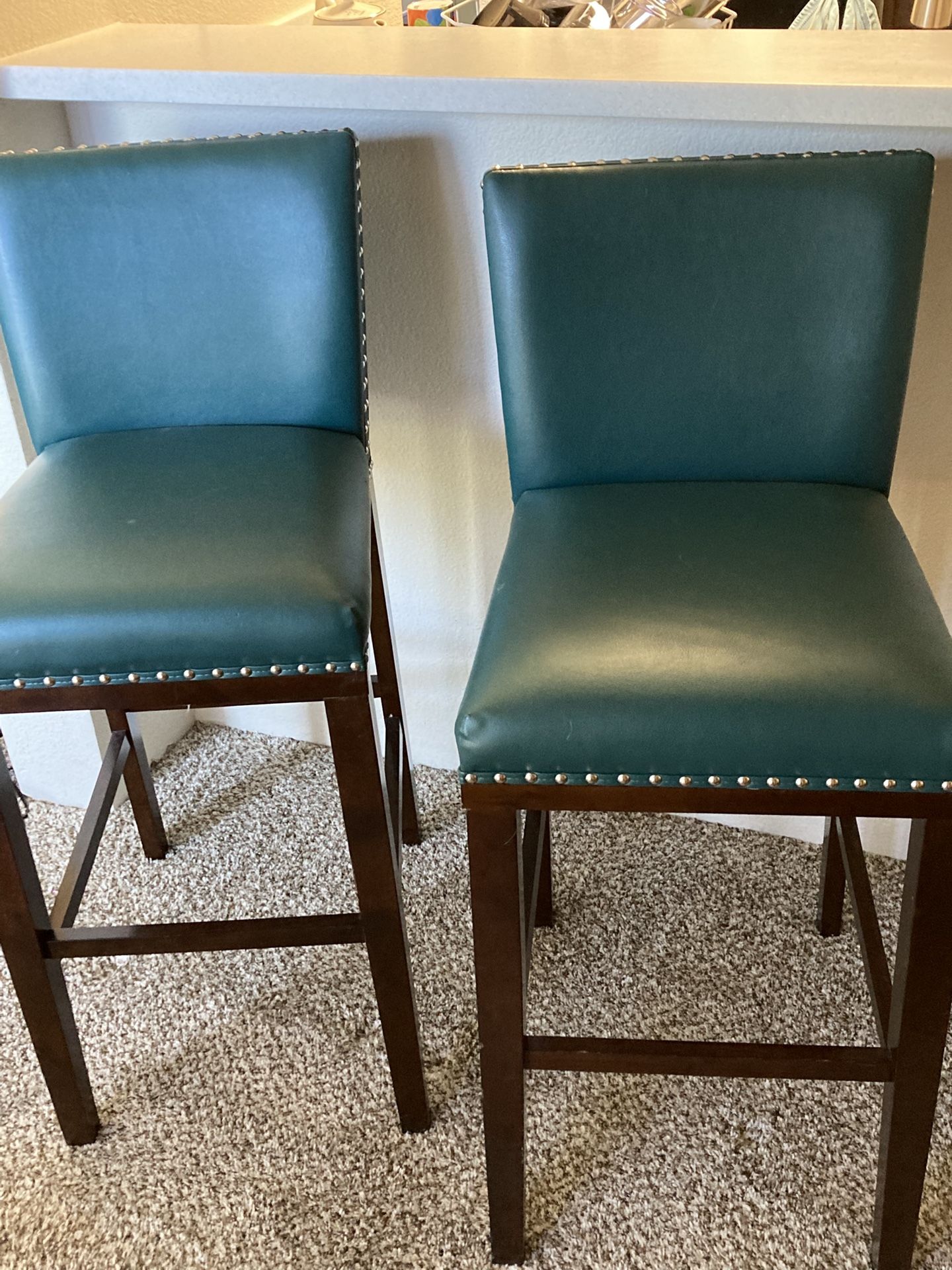 Two Teal Faux Leather Bar Stools