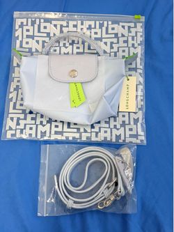 Baby blue longchamp mini bag with straps