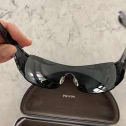Prada. MEn Women Sunglasses Black With Red. $95 Obo