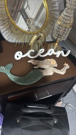 Mermaid and ocean sign