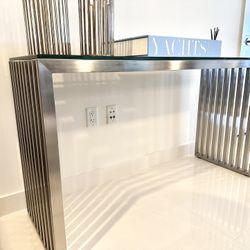 Console table  with continuous Stainless Steel  slats and thick glass top