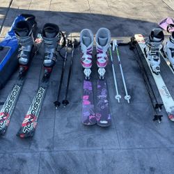 3 Sets Of Skis, Boots, Poles And Carrying Bags