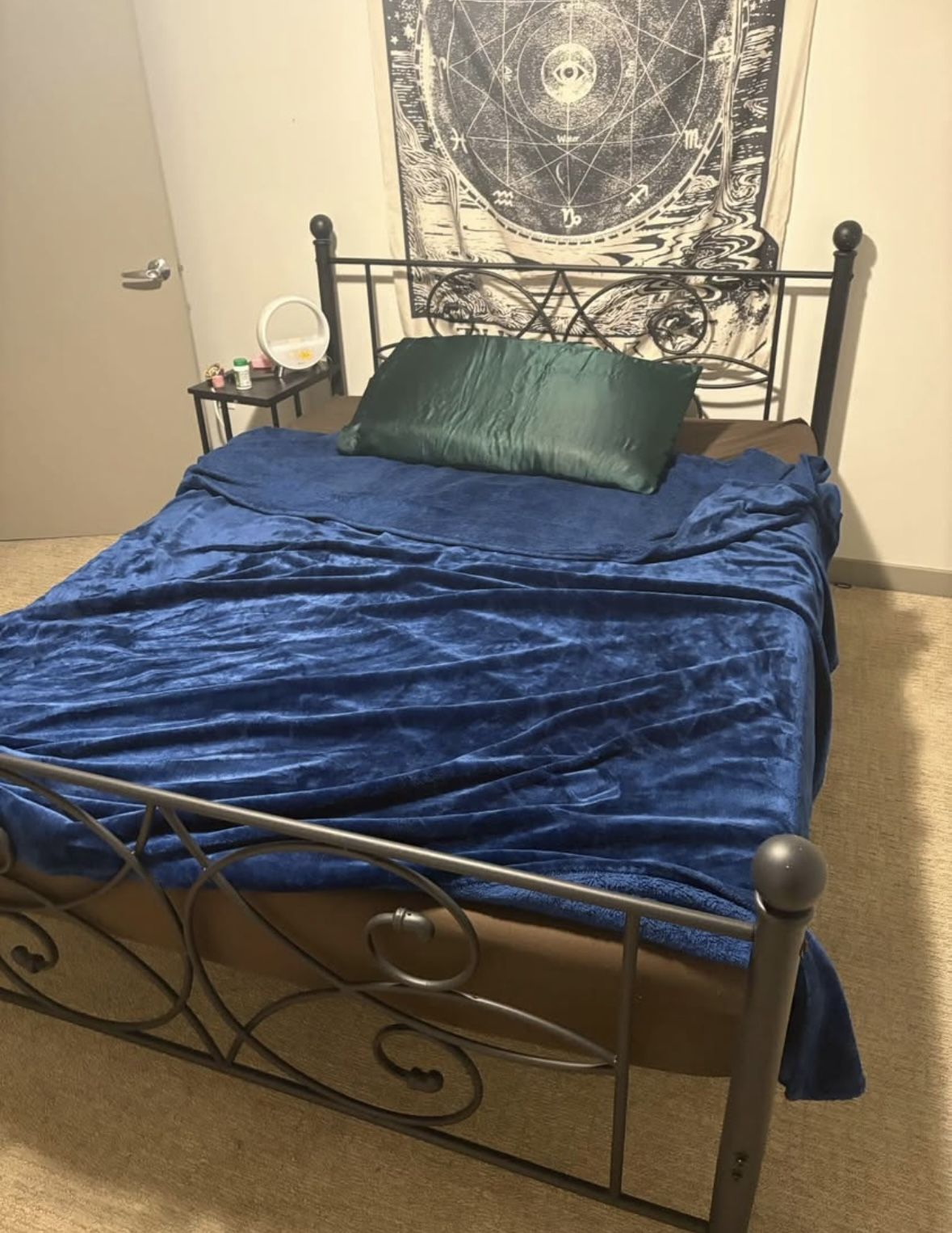 queen bed and black bed frame 