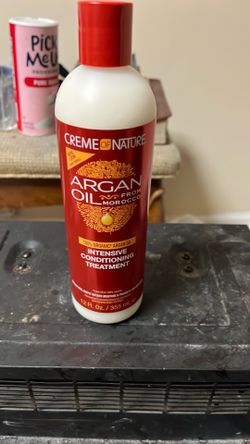 This is a 12 fl oz bottle of Creme of Nature Intensive Conditioning Treatment infused with 100% organic Argan Oil from Morocco
