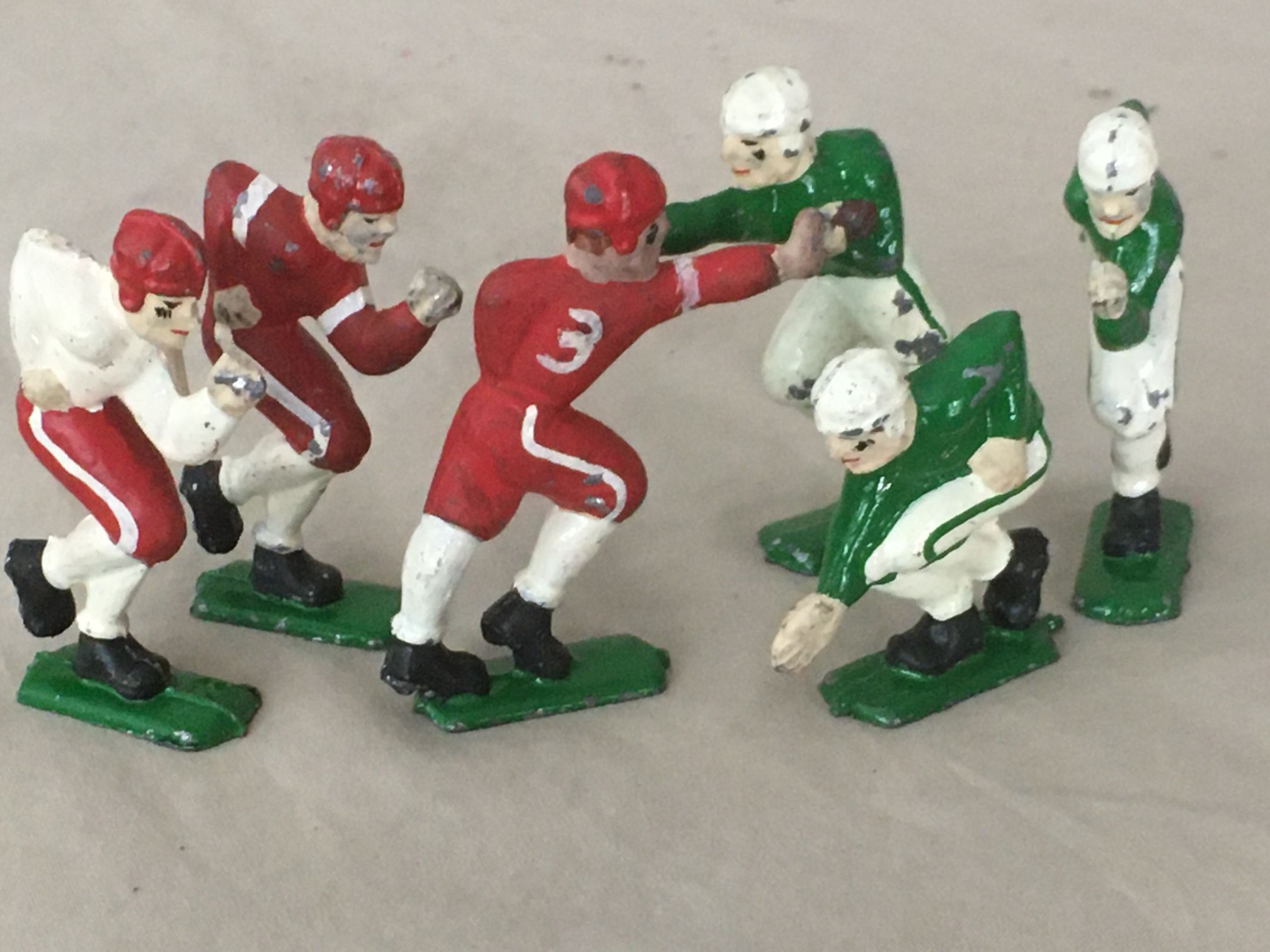 6 Antique Cast Iron Football Players