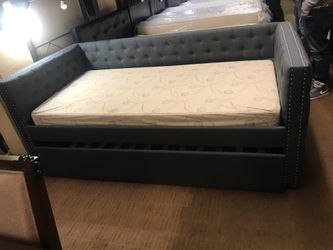 Tufted grey day bed w/trundle (Mattresses sold separately)