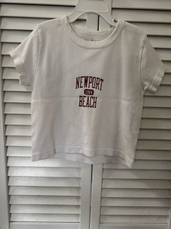 Brandy Melville White Baby Doll Top Newport Beach Graphic Cropped Crew Neck Tee One Size  Ribbed fabric stretches  Fits: XS–small  Measurement: Length
