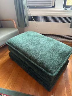 Plush green ottoman