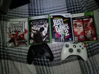 3 Xbox games and 1 wii game and 2 controllers