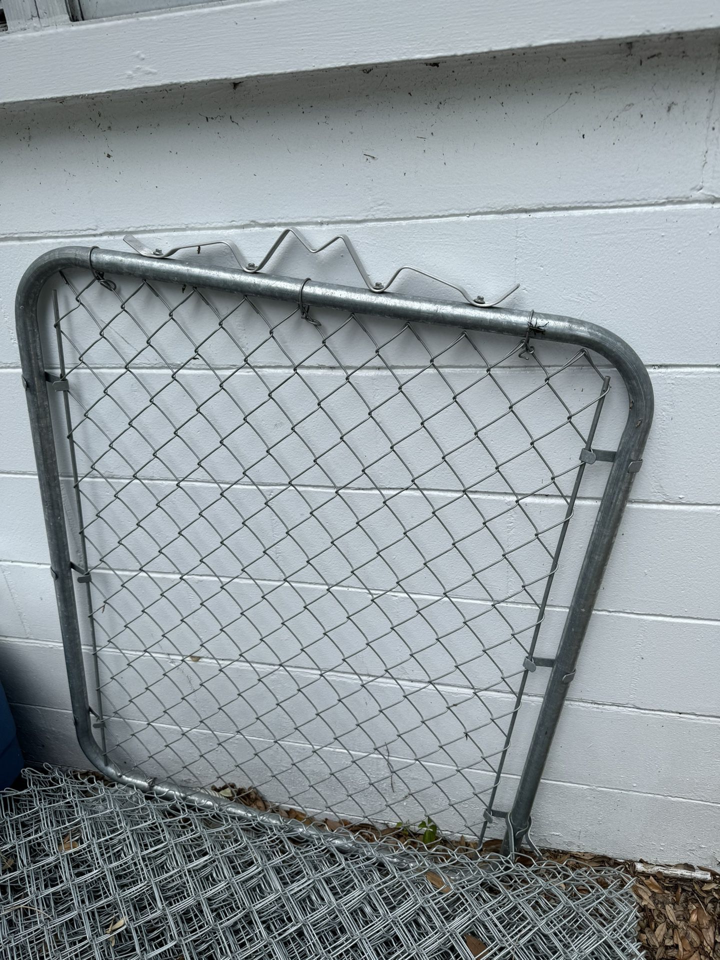 Gate Fence With A Roll Of Metal Fence 